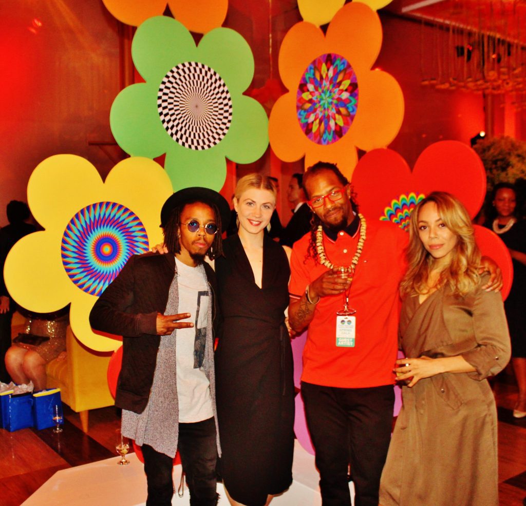 Visual Deceptions Clothing Company designer and lead dancer Phil Cuttino of PureMovement (in orange TShirt); is joined by fellow dancers including Mariah Carey look-a-like at the after party.