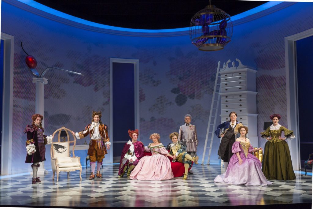 The full cast of The School For Lies and the French lush life parlor designed by Alexander Dodge.