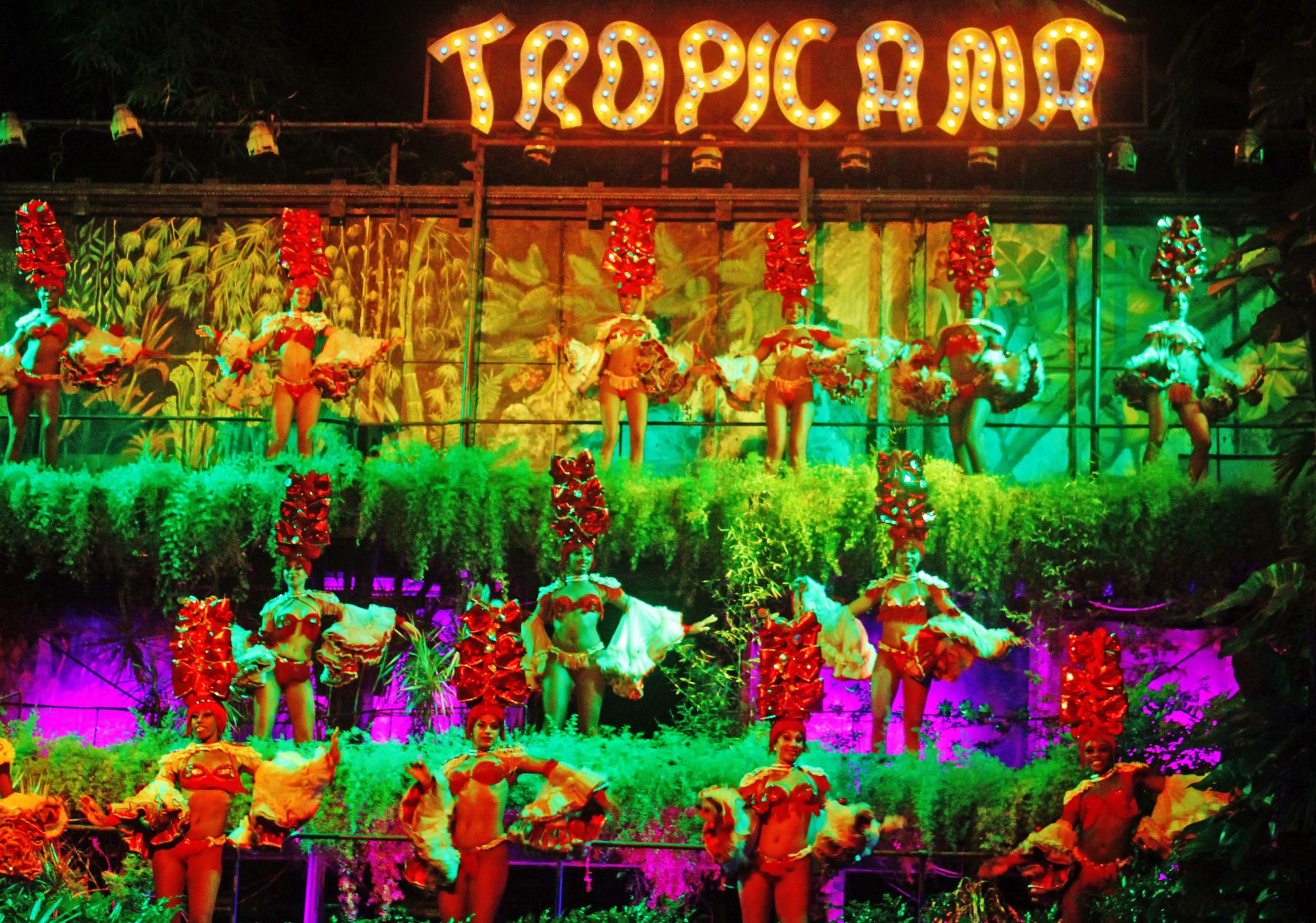 The Tropicana is a lush three tiered tropical garden setting that showcases over 100 dancers and performers on three sides of a grand ballroom sized center stage.